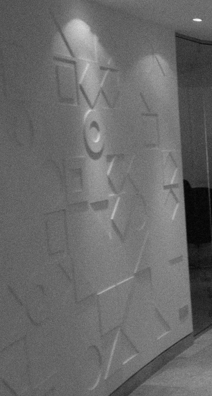 Geometric plaster relief wall detail